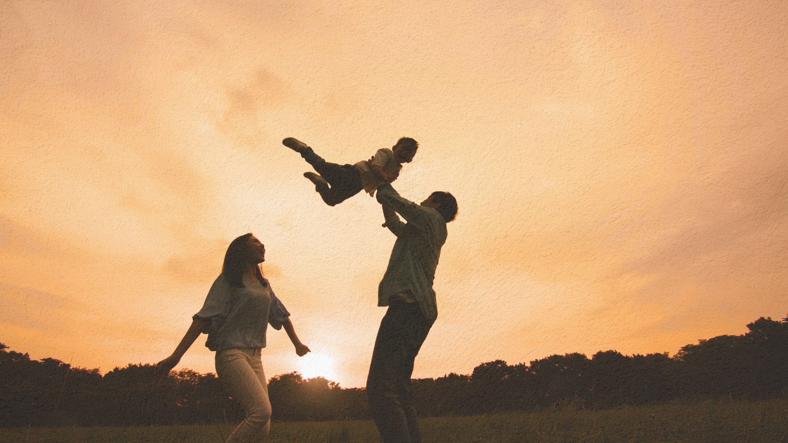 Parents walking with their son